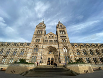 Low angle view of natural history museum building against sky