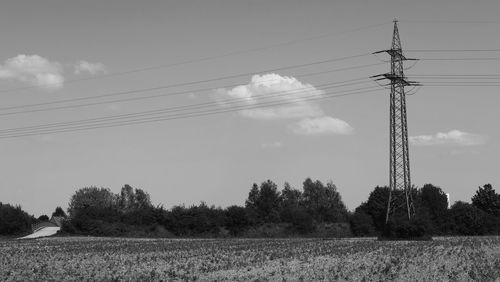 Electricity pylon on field