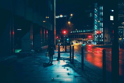 Illuminated city street at night