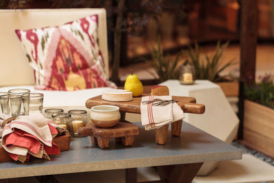 High angle view of cheese and pear on table at patio