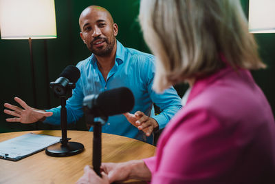 Side view of young woman using mobile phone