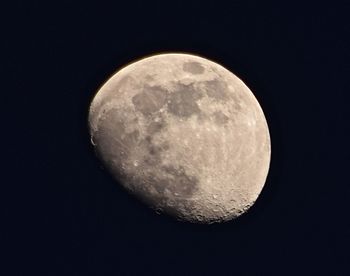 Low angle view of moon against clear sky at night