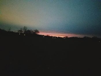 Silhouette landscape against sky during sunset