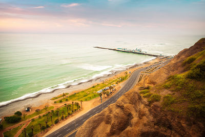 High angle view of beach against sky during sunset