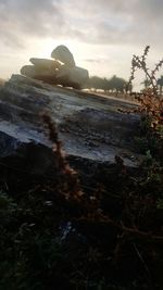 Close-up of water against sky during sunset