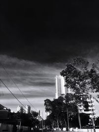 Low angle view of building against cloudy sky
