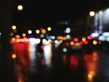 Defocused image of illuminated city at night