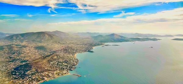 Aerial view of landscape and sea against sky