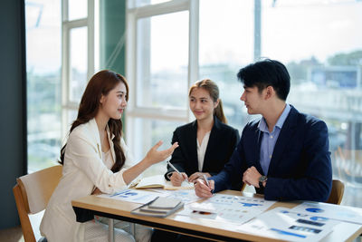 Business colleagues having discussion at office