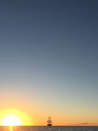 Scenic view of sea against clear sky during sunset