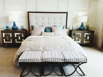 Table and chairs on bed at home