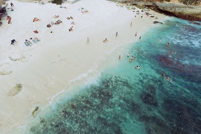 Aerial view of people enjoying at seaside