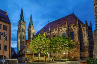 Panoramic view of temple and buildings against sky