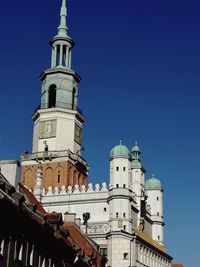 Low angle view of building against clear blue sky