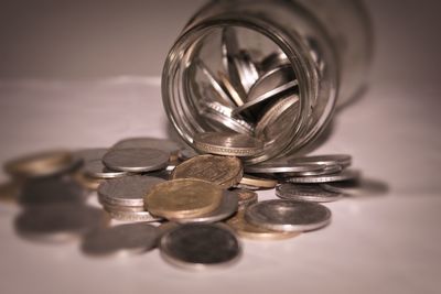 Close-up of coins on table
