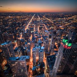 High angle view of illuminated buildings in city