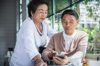 Man using smart phone outdoors