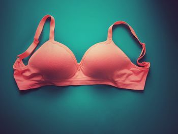 Close-up of bra on blue background