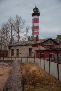 View of lighthouse and buildings against sky