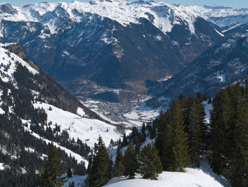 Scenic view of snow covered mountains