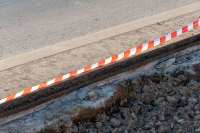 High angle view of arrow symbol on road