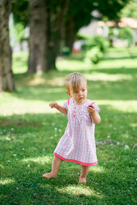 Cute girl standing at park