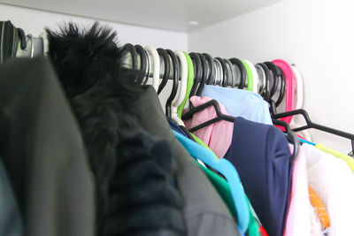 Close-up of clothes on rack in store