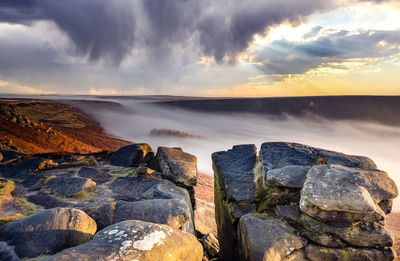 Scenic view of valley against sky during sunset