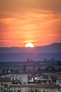 High angle view of townscape against sky during sunset