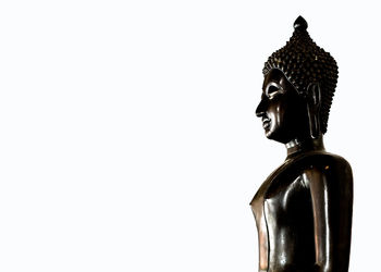 Statue of buddha against white background