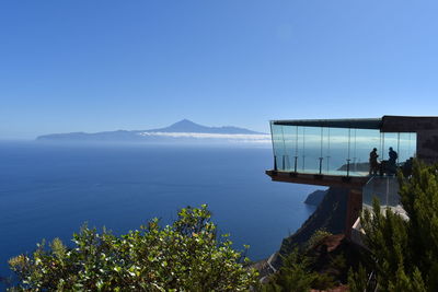 Scenic view of sea against clear blue sky