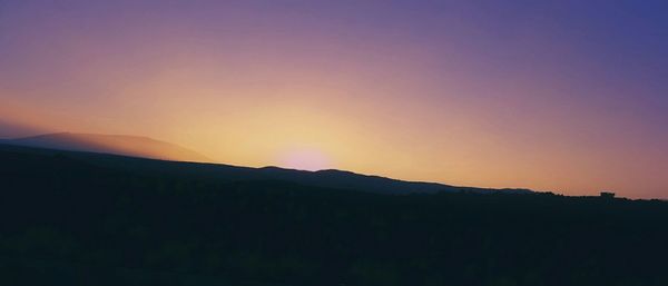 Scenic view of mountains at sunset