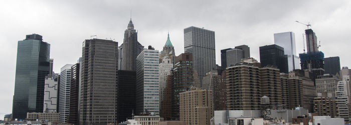 Low angle view of skyscrapers in city against sky