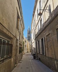 Narrow alley amidst buildings in town