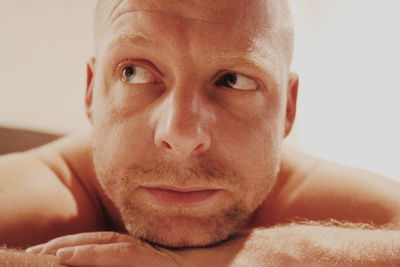 Close-up portrait of shirtless man