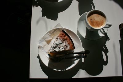 High angle view of cake and coffee on table