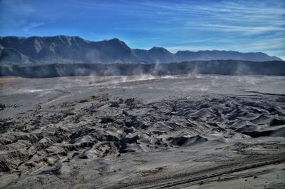 Scenic view of volcanic landscape against sky