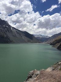 Scenic view of lake and mountains against sky