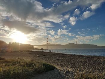 Scenic view of beach against sky during sunset