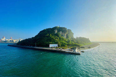 Scenic view of sea against clear blue sky
