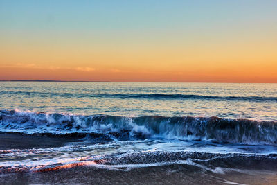 Scenic view of sea against sky during sunset