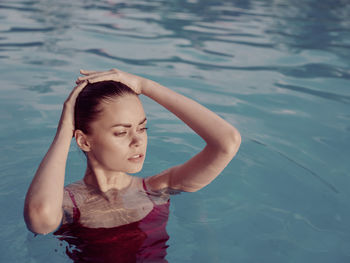 High angle view of woman swimming in pool