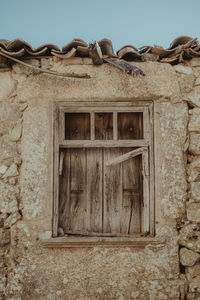 Low angle view of window of old building