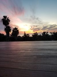 Scenic view of silhouette trees against sky at sunset