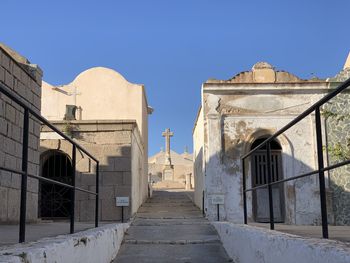 Low angle view of historic building against clear blue sky