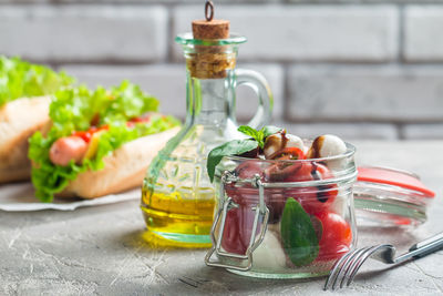 Close-up of drink in glass jar on table