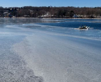 Scenic view of frozen lake against sky