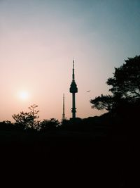 Low angle view of communications tower against sky