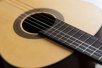 High angle view of guitar on table