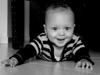 Portrait of smiling girl sitting at home